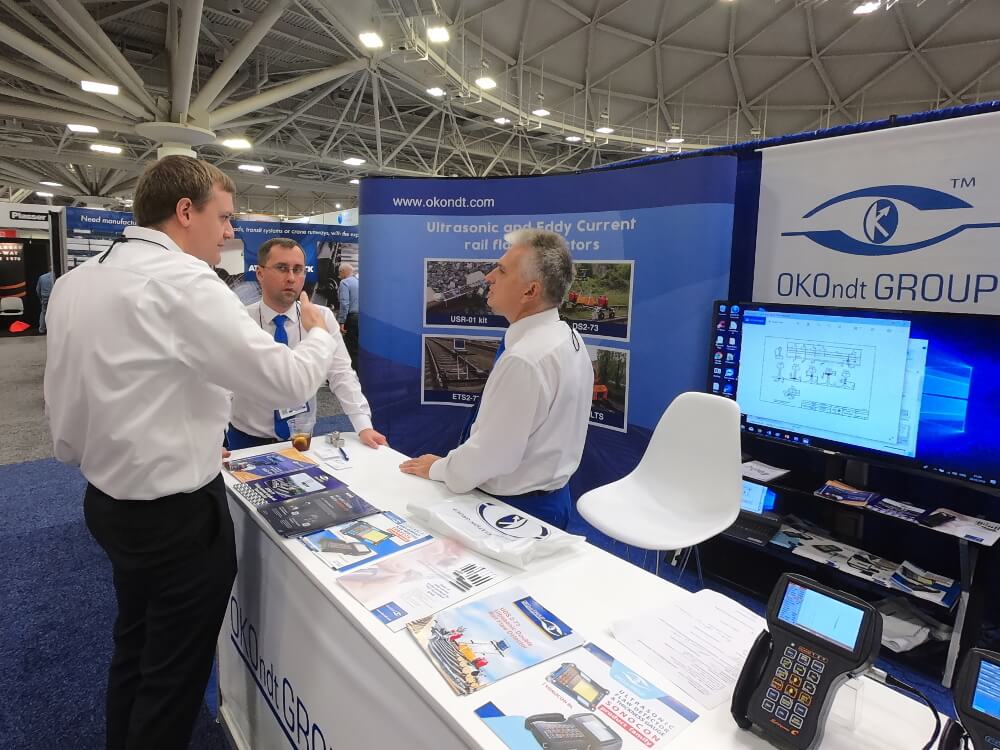 Discussion with a potential customer at OKOndt GROUP's booth — Railway Interchange Exhibition 2019