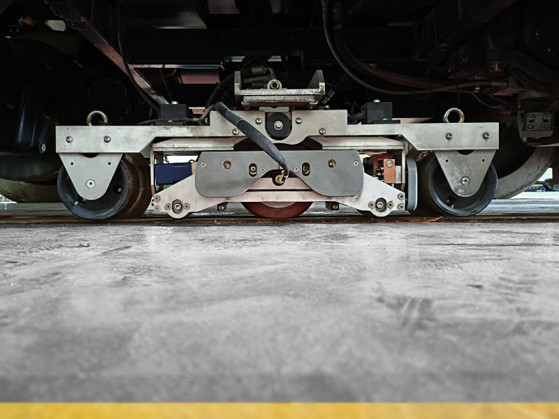 Ultrasonic rail inspection module installed on a high-speed railway track inspection vehicle for non-destructive testing.